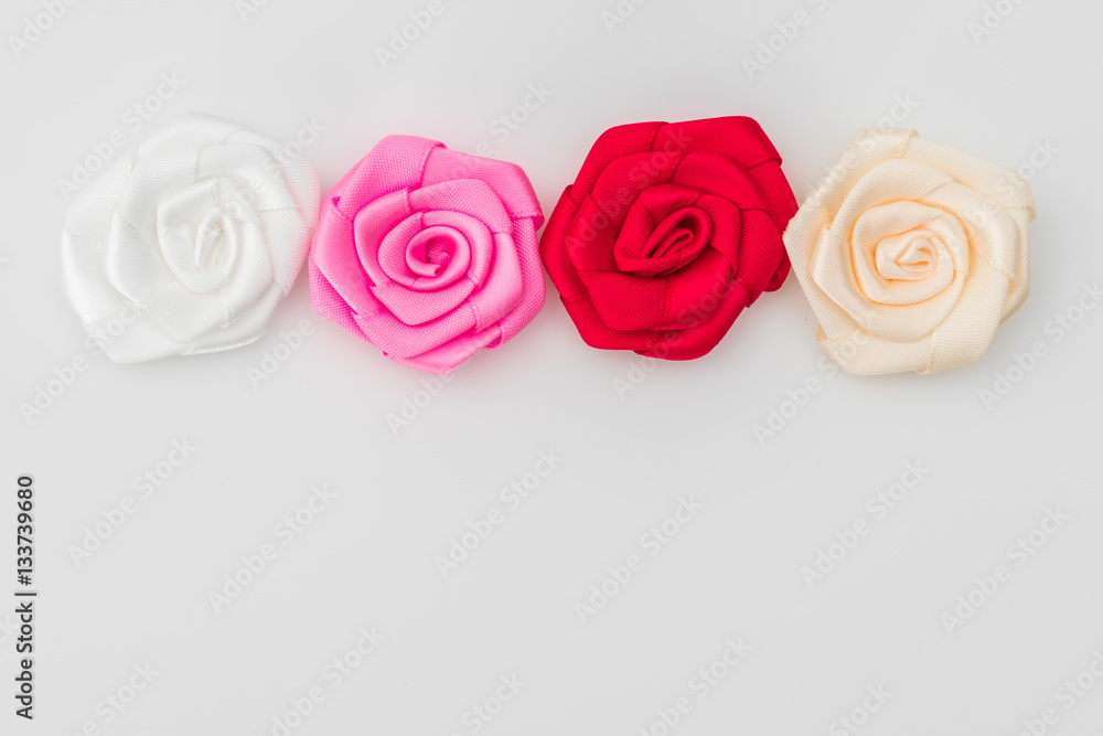 Fototapeta premium Rose flower of ribbon on white background .