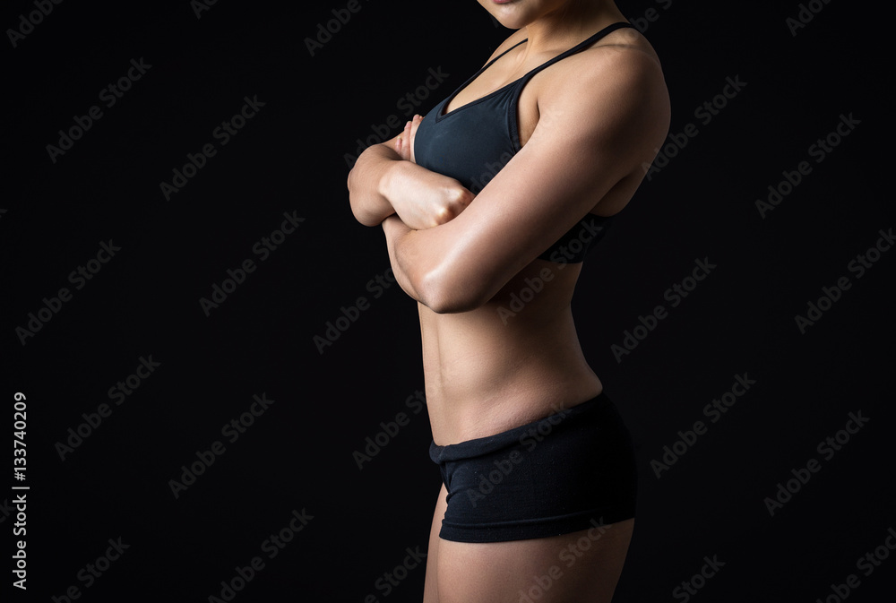 Naklejka premium Beautiful body of fitness woman