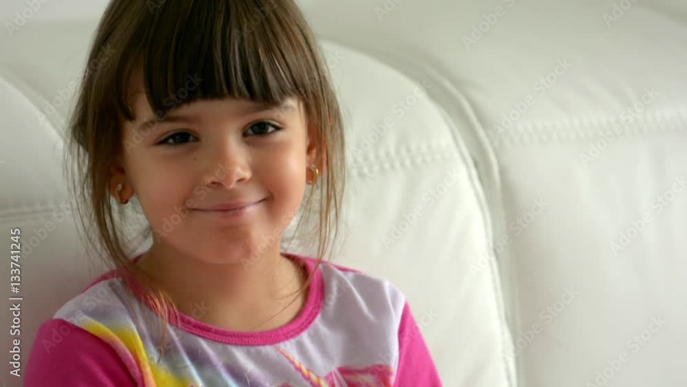 Child Watching TV, Sleepy Little Girl Lying on sofa, Coach, Close Up, Children Child Watching TV, Sleepy Little Girl Lying on sofa, Coach, Close Up, Children