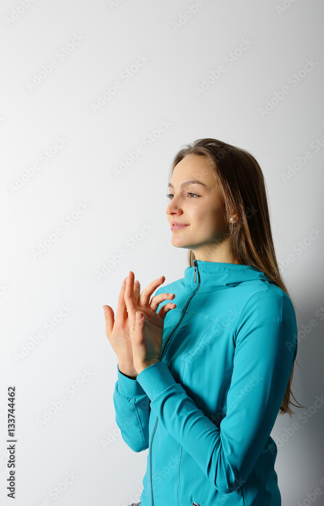 Young woman performing an exercise of yoga breathing Young woman performing an exercise of yoga breathing