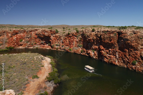 View of Yardie Creek Gorge with a tourist boat. Cape Range National Park in Western Australia, Australia