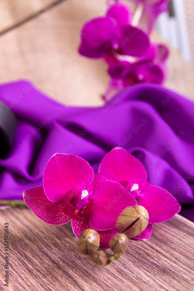 Close up of purple orchid on wooden background. Close up of purple orchid on wooden background.
