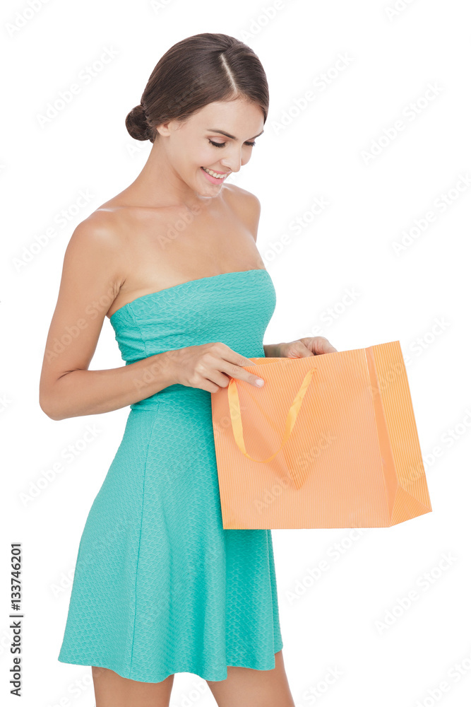 beautiful woman smiling while looking to the inside of her shopp beautiful woman smiling while looking to the inside of her shopp