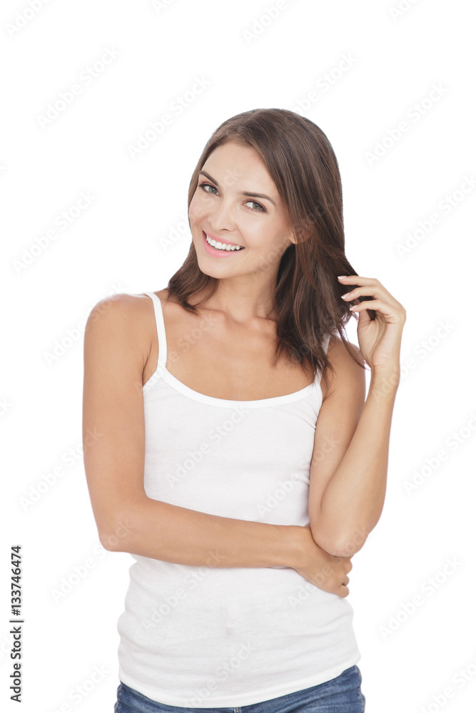 beautiful woman smiling while touching her hair beautiful woman smiling while touching her hair