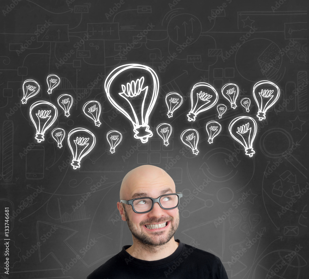 Bulb lamp icons going out of the head of a Young attractive smil Bulb lamp icons going out of the head of a Young attractive smil