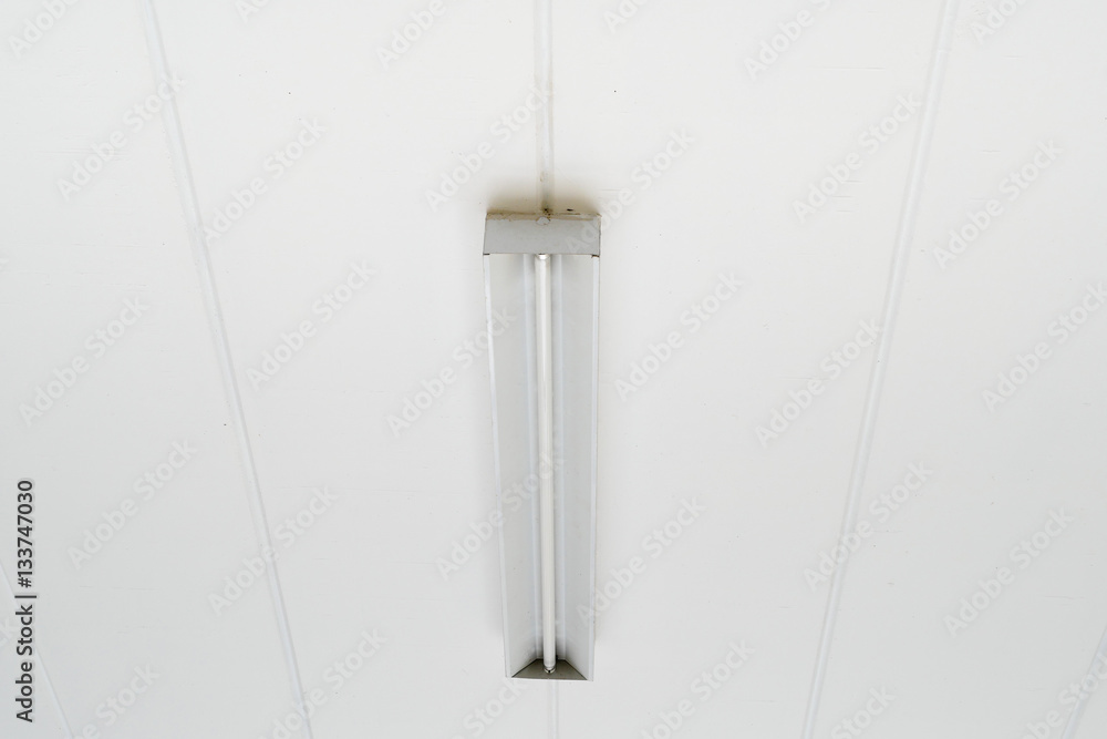 Fluorescent lamp at a white ceiling Fluorescent lamp at a white ceiling