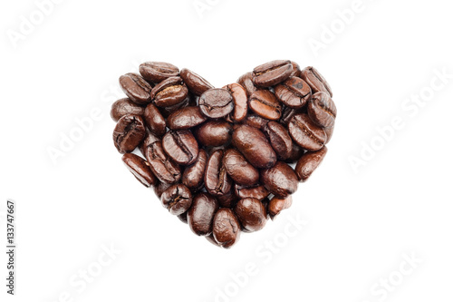 Coffee beans in heart shape isolated on white background