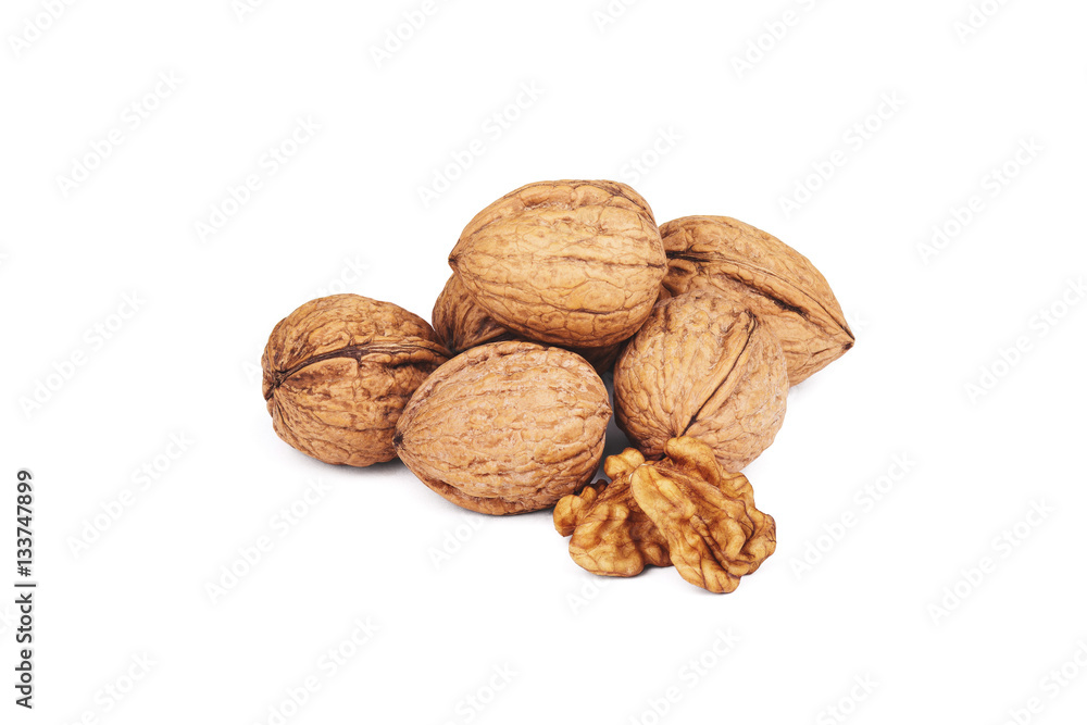Walnut kernels and whole walnuts on white background Walnut kernels and whole walnuts on white background