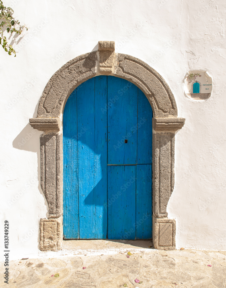 Fototapeta premium a door with typically marine colors photographed during an excursion to Panarea, a Sicilian island near Stromboli which is part of the Aeolian archipelago