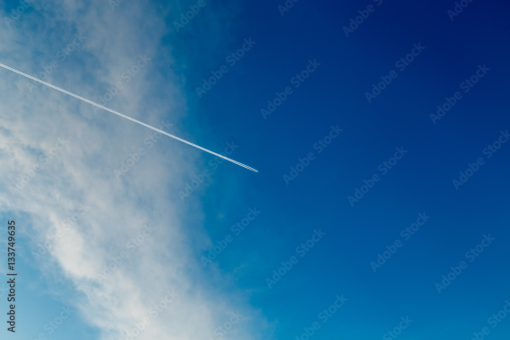 Trace from the plane in a blue sunny sky Trace from the plane in a blue sunny sky