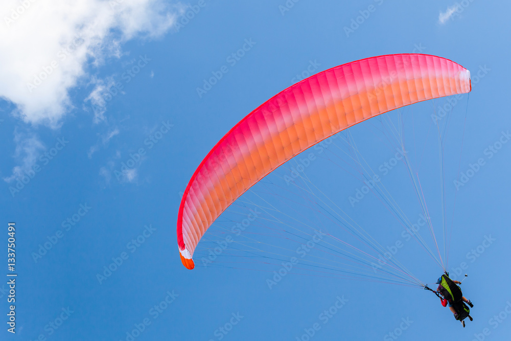 Paragliders in blue sky with clouds, tandem Paragliders in blue sky with clouds, tandem
