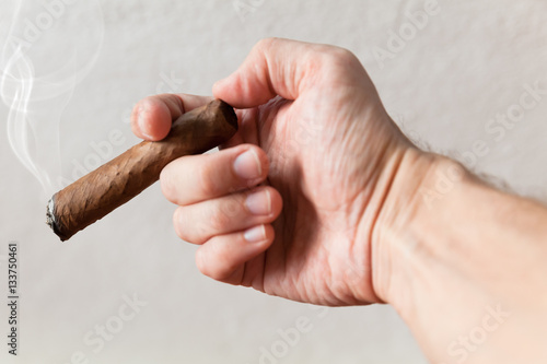 Handmade cigar in male hand