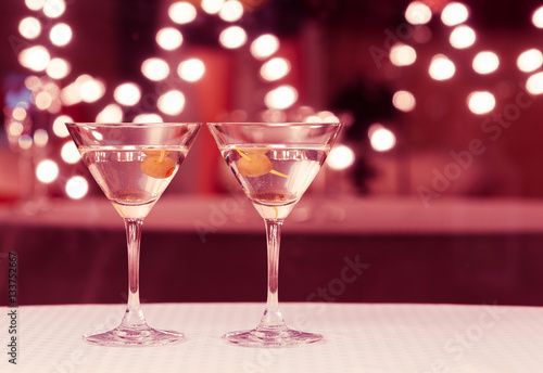 Pair of classic martini drinks on a restaurant bar. 