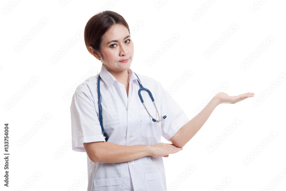 Asian young female doctor show something on her hand. Asian young female doctor show something on her hand.