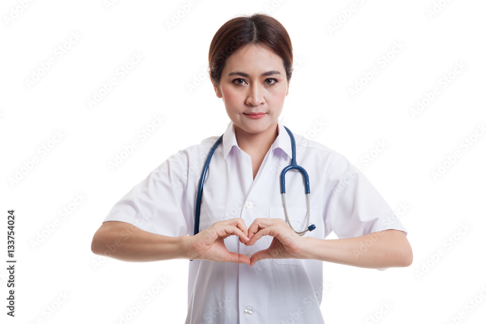 Portrait of Asian female doctor show heart hand sign. Portrait of Asian female doctor show heart hand sign.