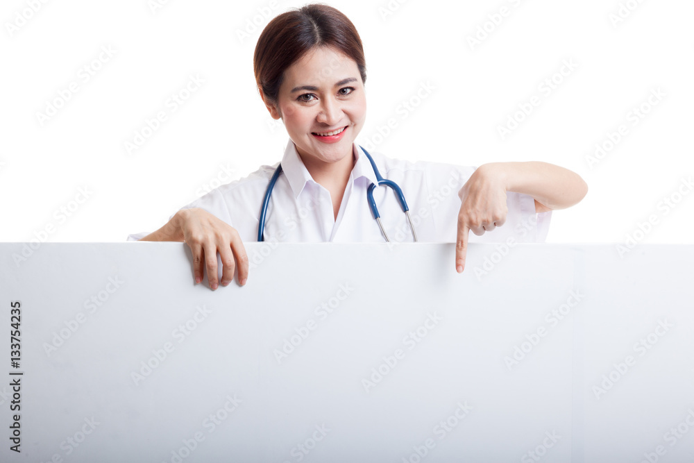 Young Asian female doctor point down to blank sign. Young Asian female doctor point down to blank sign.
