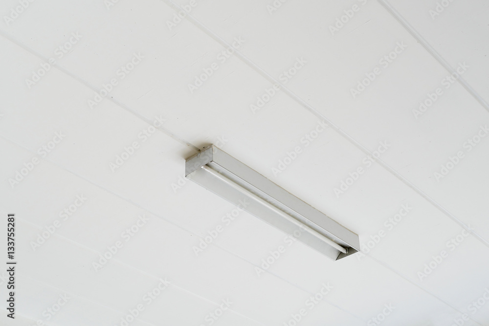 Fluorescent lamp at a white ceiling Fluorescent lamp at a white ceiling