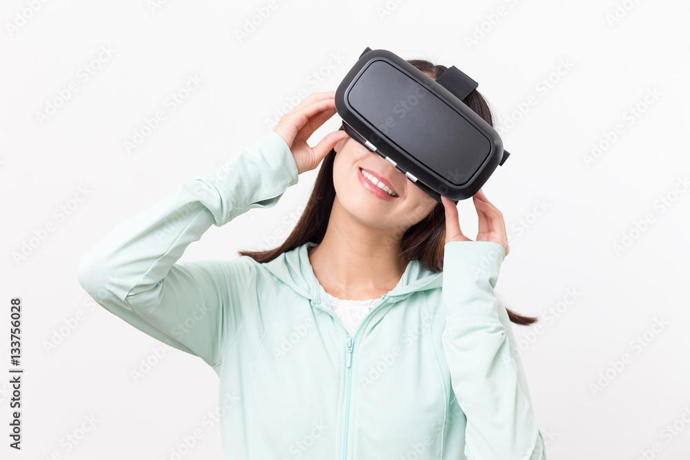 Woman looking though virtual reality device Woman looking though virtual reality device
