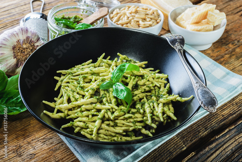 Trofie pasta with vegetarian sauce, pesto with pine nuts and bas