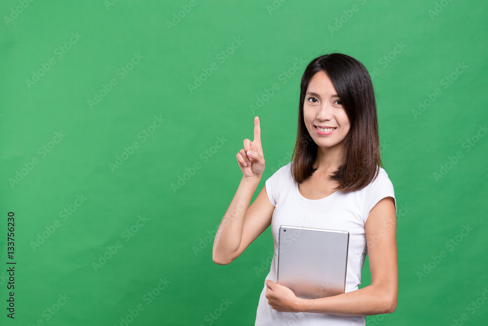 Woman holding tablet computer and finger up Woman holding tablet computer and finger up