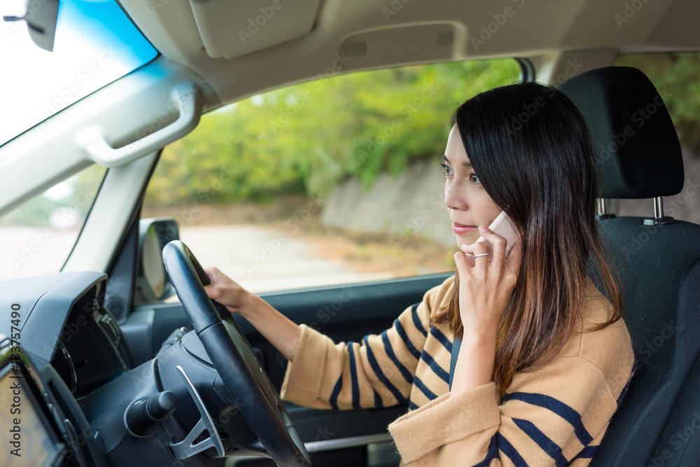 Woman talk to cellphone and driving car