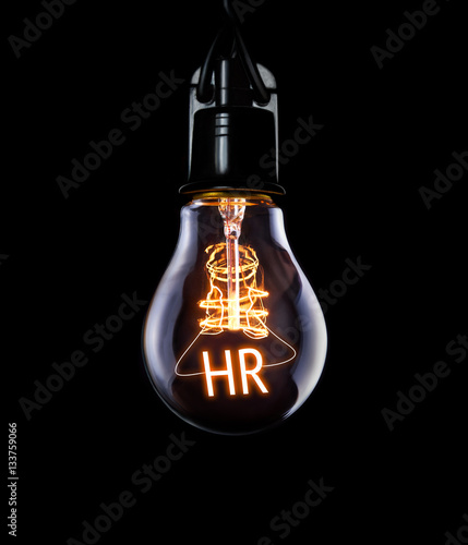 Hanging lightbulb with glowing HR concept.