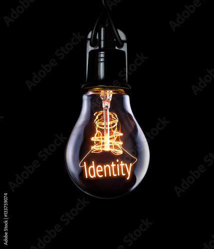 Hanging lightbulb with glowing Identity concept.