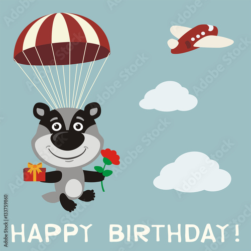 Happy birthday! Funny badger fly on parachute with gift and flower. Birthday card with badger in cartoon style.