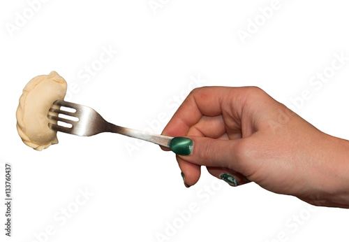 Dumpling on a fork. Isolated on white.