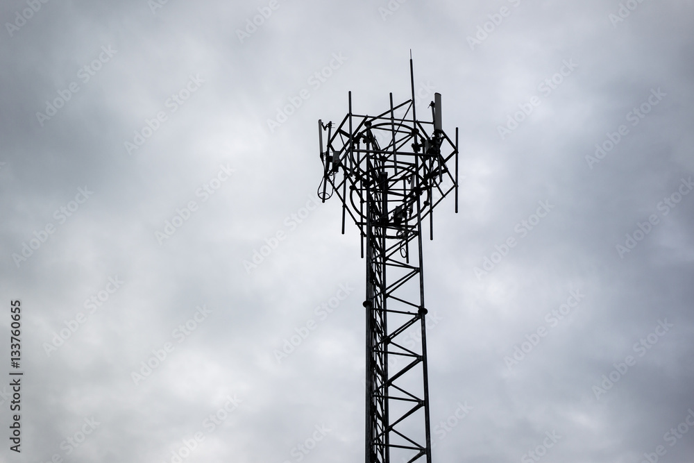Shadow of telecommunication tower in the dark cloud sky. Shadow of telecommunication tower in the dark cloud sky.
