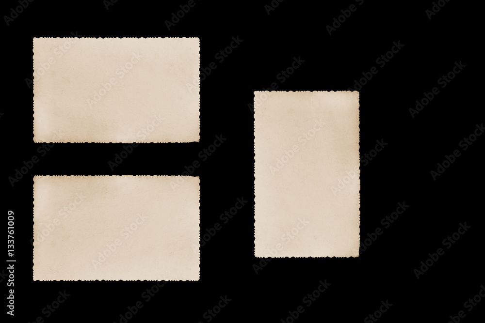 Obraz premium Three blank vintage photos with jagged edges on the black background. Two horizontally and one vertically are ready for your text.