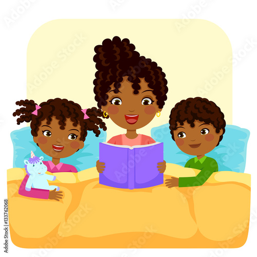 dark skinned woman reading bedtime story to children