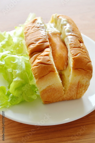 bread filled pork sausage dressing mayonnaise with green oak on plate photo