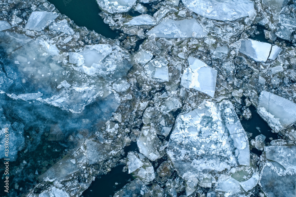 Ice floe floating on river Ice floe floating on river