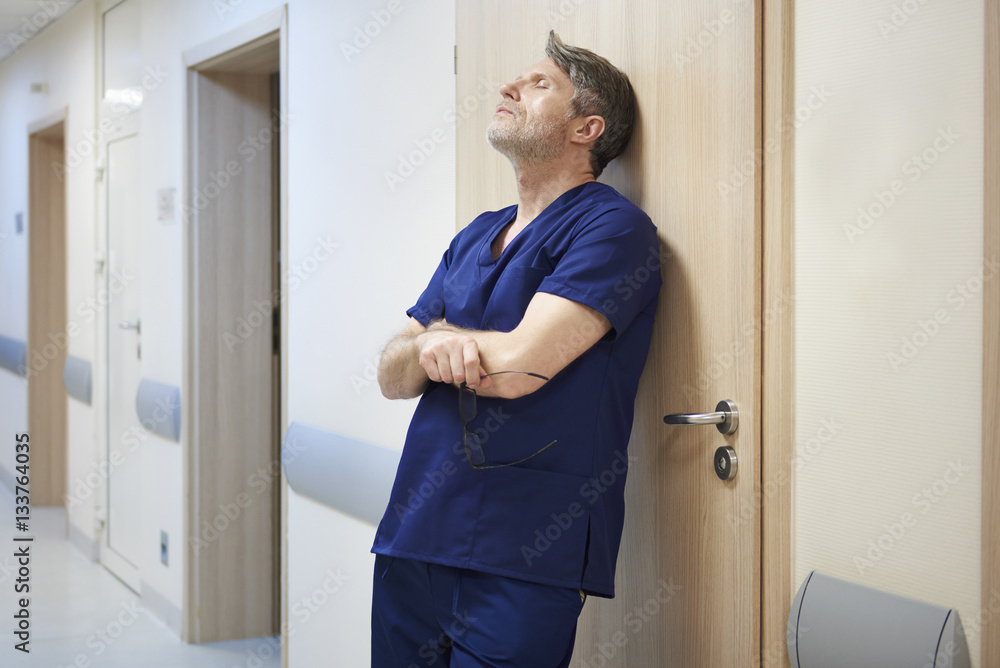Fototapeta premium Tired doctor after long day at work
