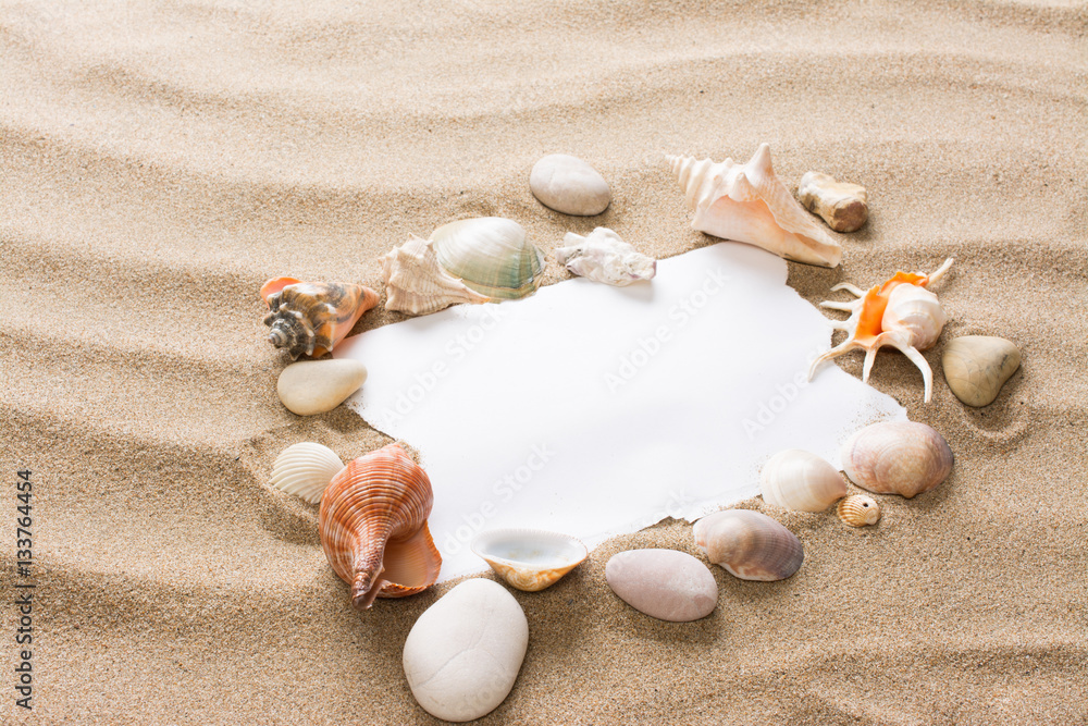 Obraz premium Message in torn paper on the beach. Summer background with hot s