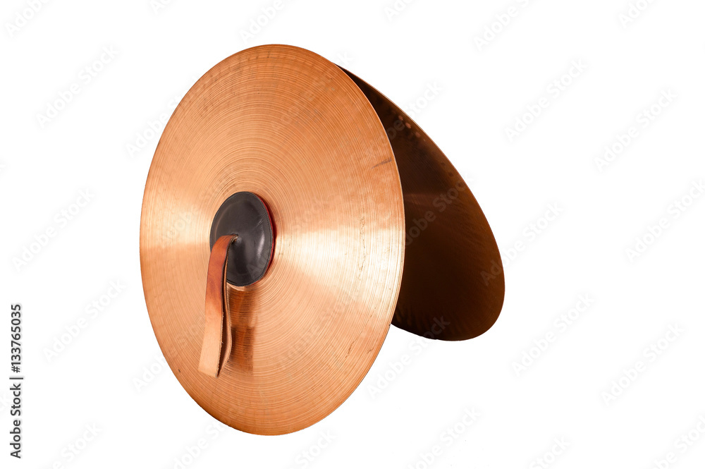 Naklejka premium Close up of an prcussion cymbals with leather handle isolated on background.