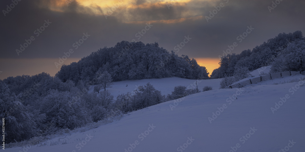 Winter landscape sunset on the slopes