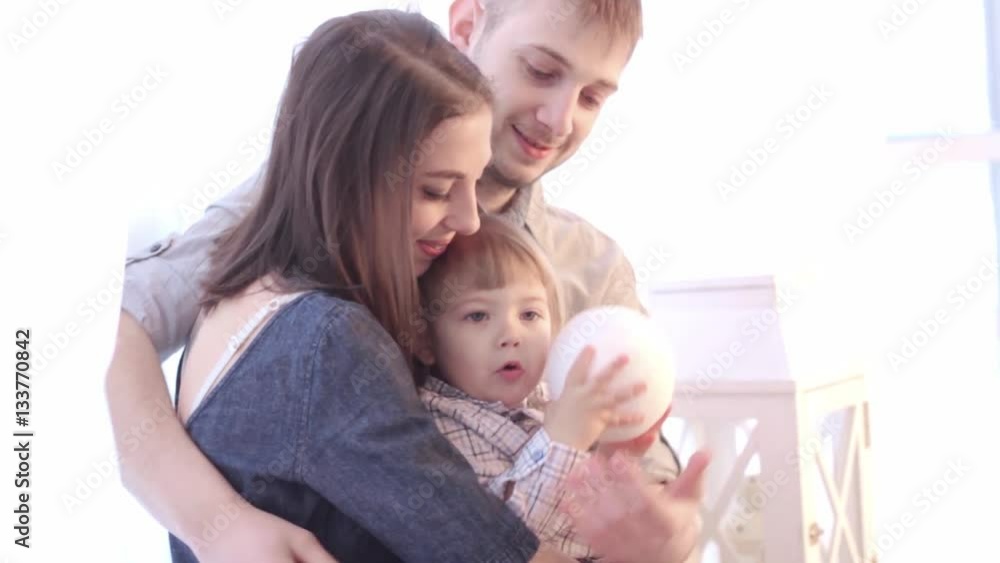 a child plays with a ball with mom a child plays with a ball with mom