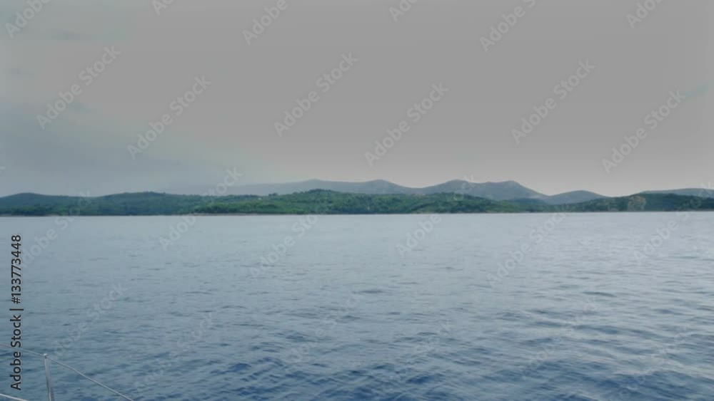 There is a bad weather out in the sea and it is about to start raining soon. A sailing boat is still sailing in the sea.
There is a bad weather out in the sea and it is about to start raining soon. A sailing boat is still sailing in the sea.