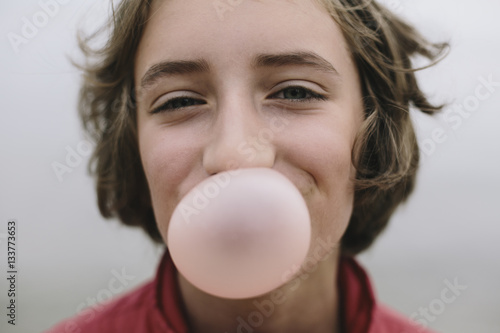 Girl blowing bubble gum