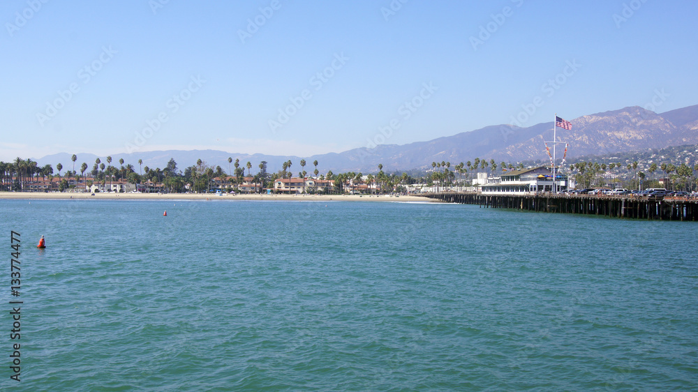 SANTA BARBARA, CALIFORNIA, USA - OCT 8th, 2014: View of palm trees on the shore and mountains from Stearn's Wharf