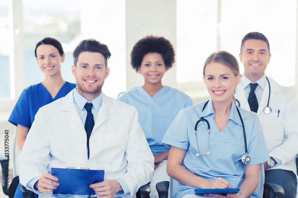 group of happy doctors on seminar at hospital group of happy doctors on seminar at hospital
