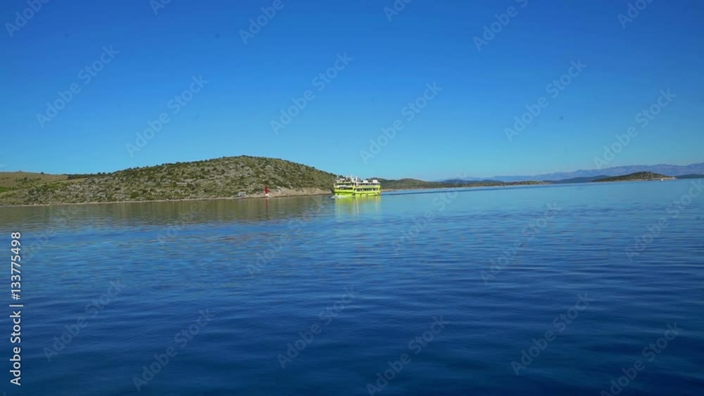We can see a yellow ship sailing on the sea in the distance. There is a big island nearby. The day is sunny and warm.
We can see a yellow ship sailing on the sea in the distance. There is a big island nearby. The day is sunny and warm.