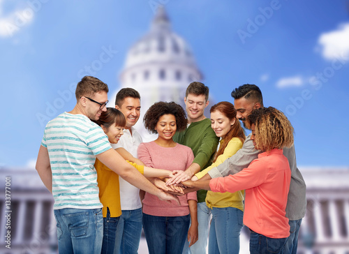 Obraz na plátně international group of happy people holding hands