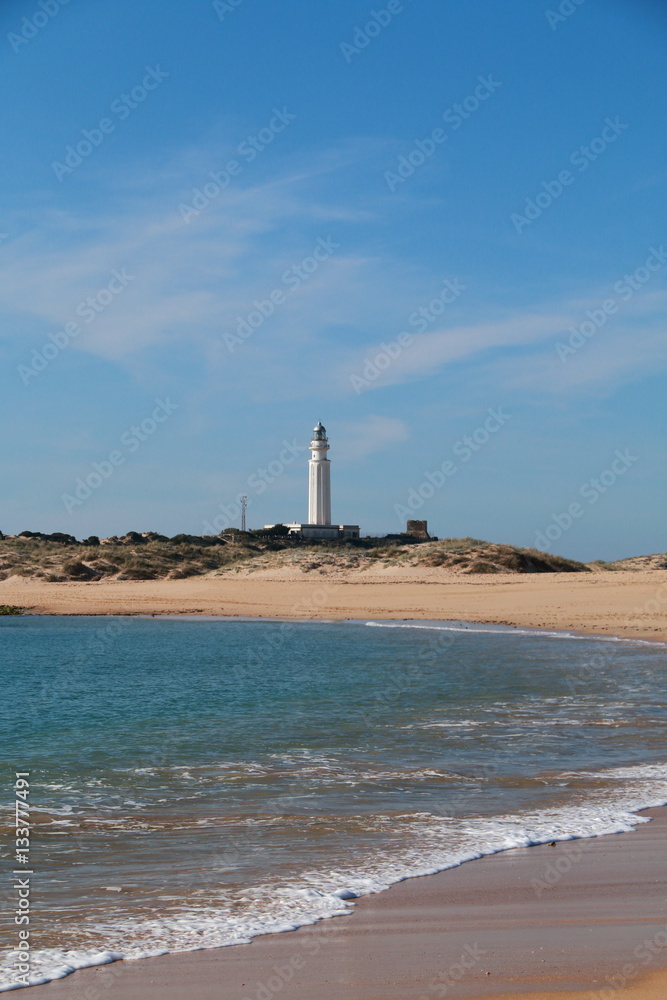 Seascape with the Trafalgar lighthouse in the background, on the shores of southern Spain
