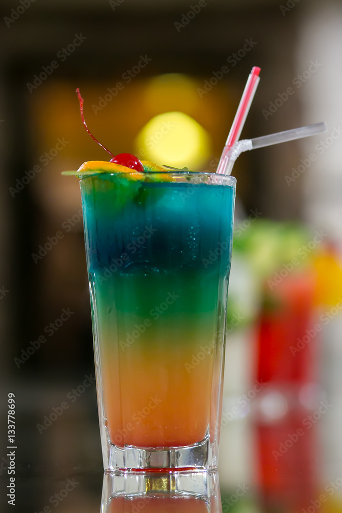 Juicy Orange and Red Tequila Sunrise with a Cherry Juicy Orange and Red Tequila Sunrise with a Cherry