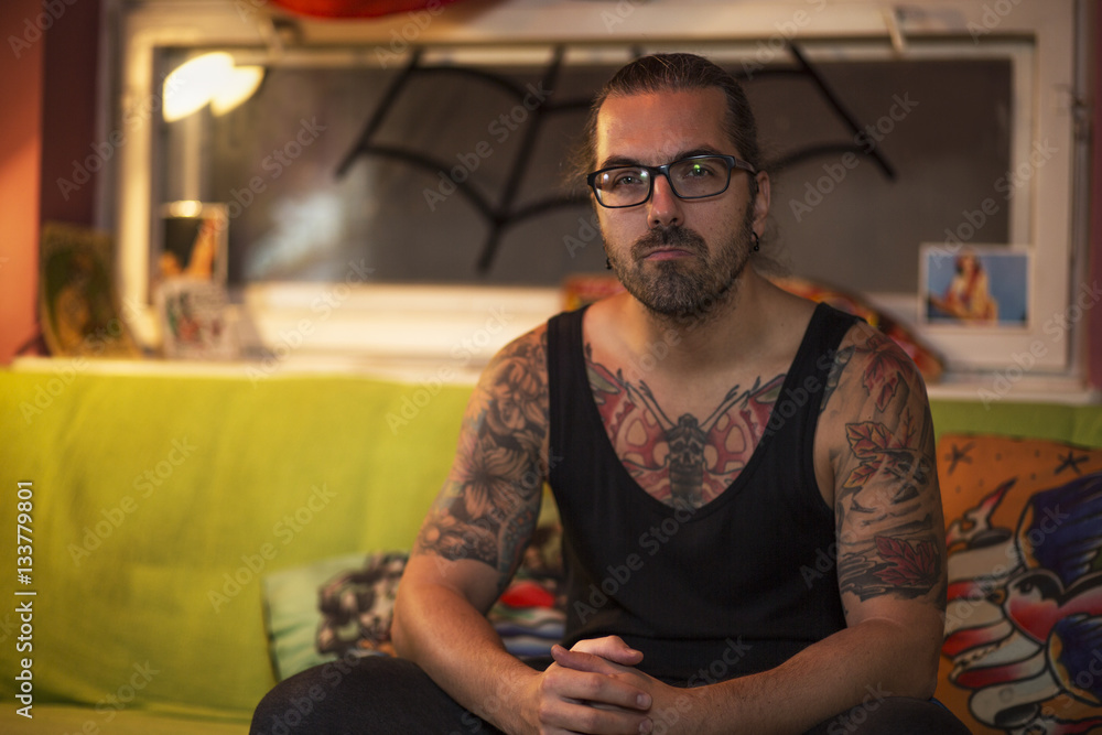 Guy is sitting in a tattoo studio.
Young handsome man customer is waiting for new tattoo. Guy is sitting in a tattoo studio.
Young handsome man customer is waiting for new tattoo.