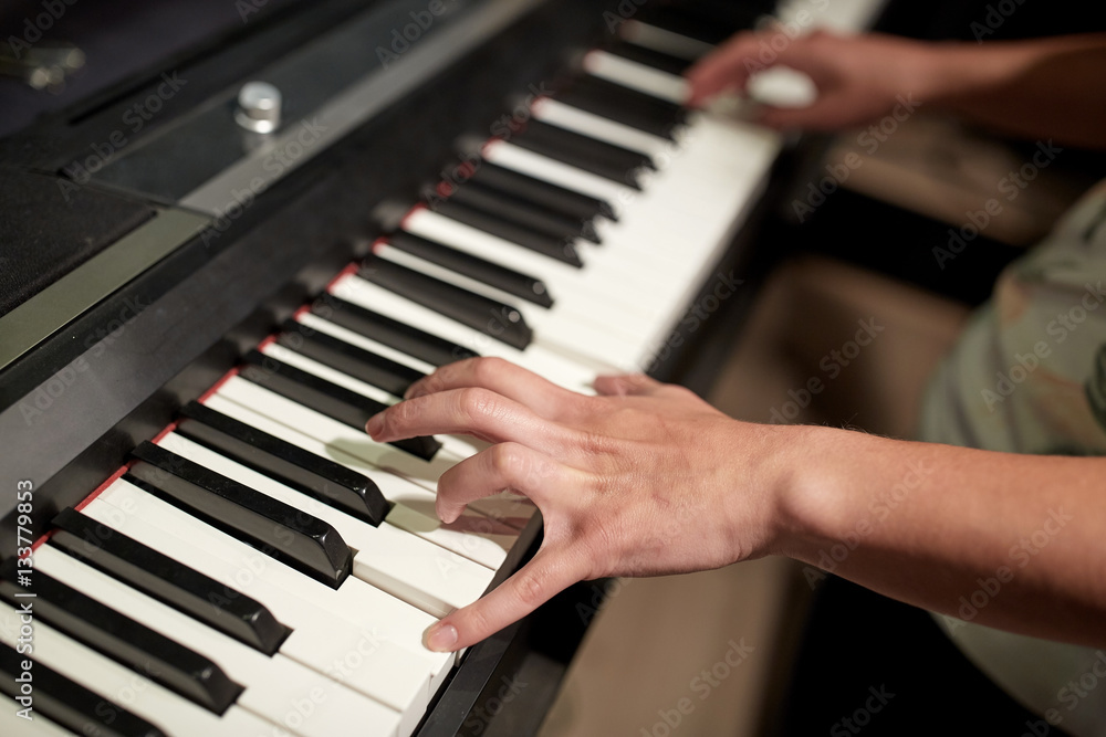 Fototapeta premium close up of hands playing piano
