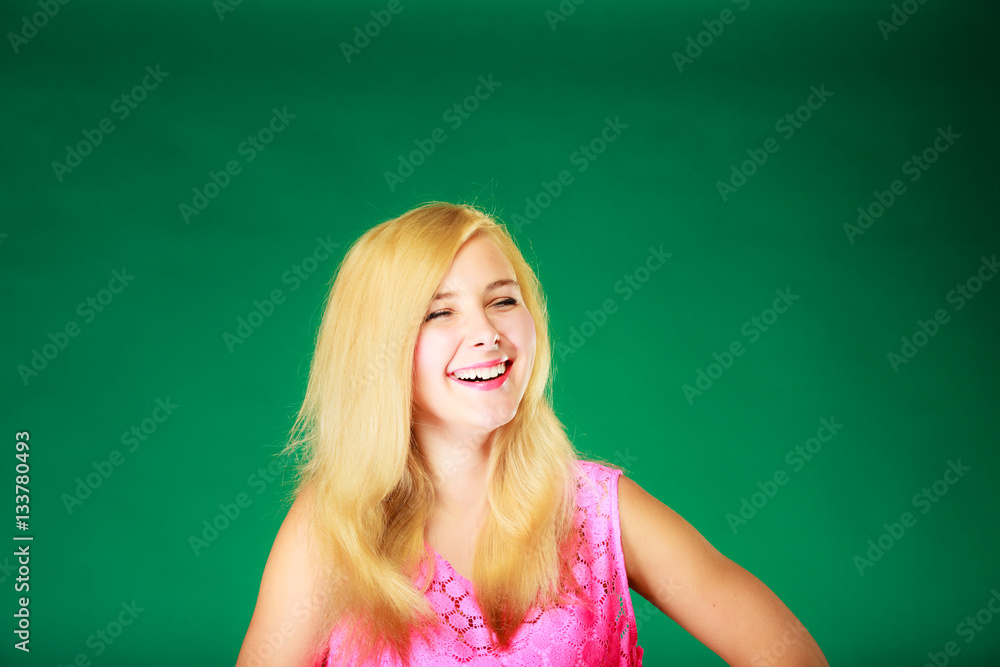Happy smiling blonde woman in pink top Happy smiling blonde woman in pink top